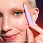 Close-up of a woman applying makeup [Bungalow]
