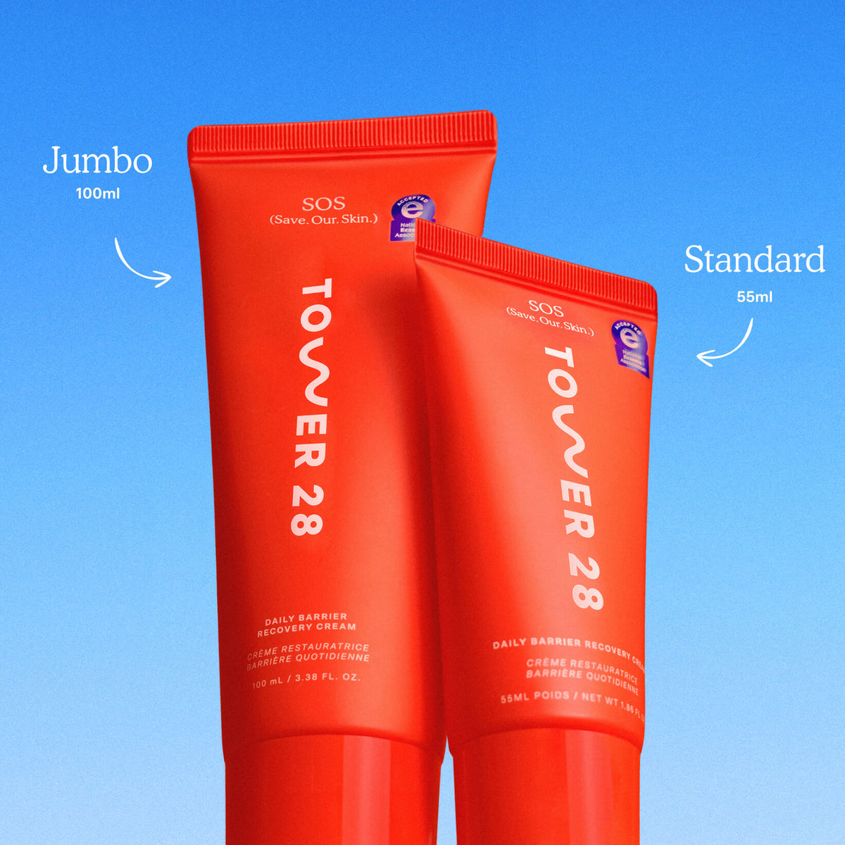 Two red tubes of Tower 28 cream labeled 'Jumbo' and 'Standard' on a blue background. [Shared]