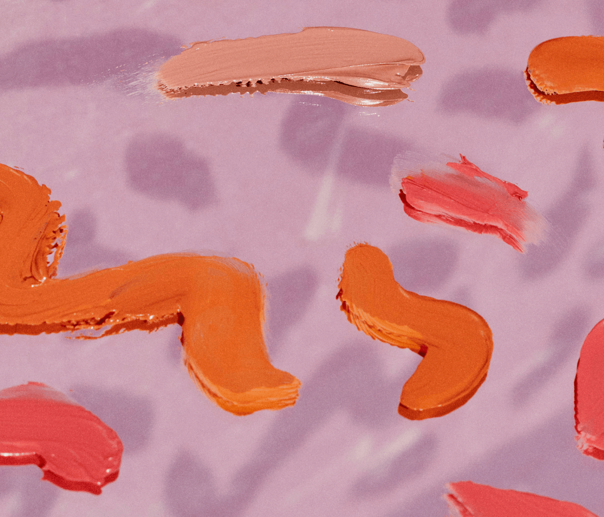 [A close up of the Tower 28 Beauty BeachPlease Cream Blush swatched across a purple background.]