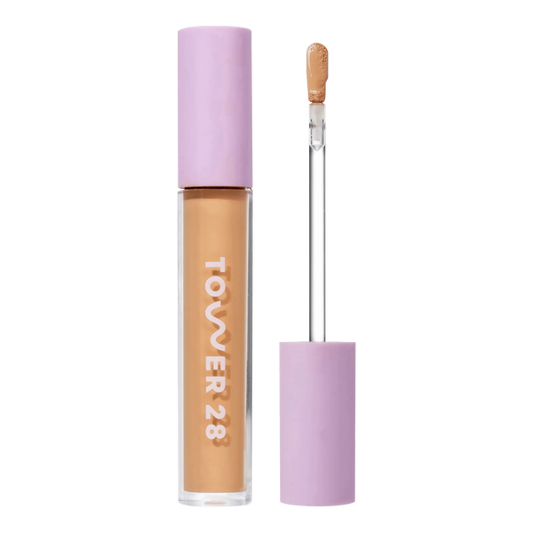 Tower 28 Beauty Swipe Serum Concealer in the shade 11.0 OC, shown with the tube standing upright next to the open applicator wand to reveal the product. [11.0 OC]