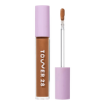 Tower 28 Beauty Swipe Serum Concealer in the shade 16.0 SB, shown with the tube standing upright next to the open applicator wand to reveal the product. [16.0 SB]