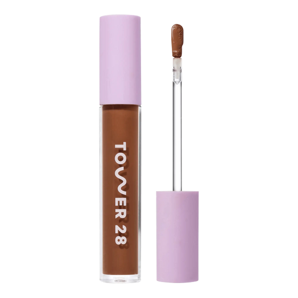 Tower 28 Beauty Swipe Serum Concealer in the shade 17.0 SD, shown with the tube standing upright next to the open applicator wand to reveal the product. [17.0 SD]