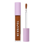 Tower 28 Beauty Swipe Serum Concealer in the shade 18.0 SGV, shown with the tube standing upright next to the open applicator wand to reveal the product. [18.0 SGV]