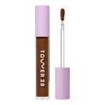 Tower 28 Beauty Swipe Serum Concealer in the shade 19.0 WEHO, shown with the tube standing upright next to the open applicator wand to reveal the product. [19.0 WEHO]