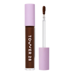 Tower 28 Beauty Swipe Serum Concealer in the shade 20.0 WLA, shown with the tube standing upright next to the open applicator wand to reveal the product. [20.0 WLA]